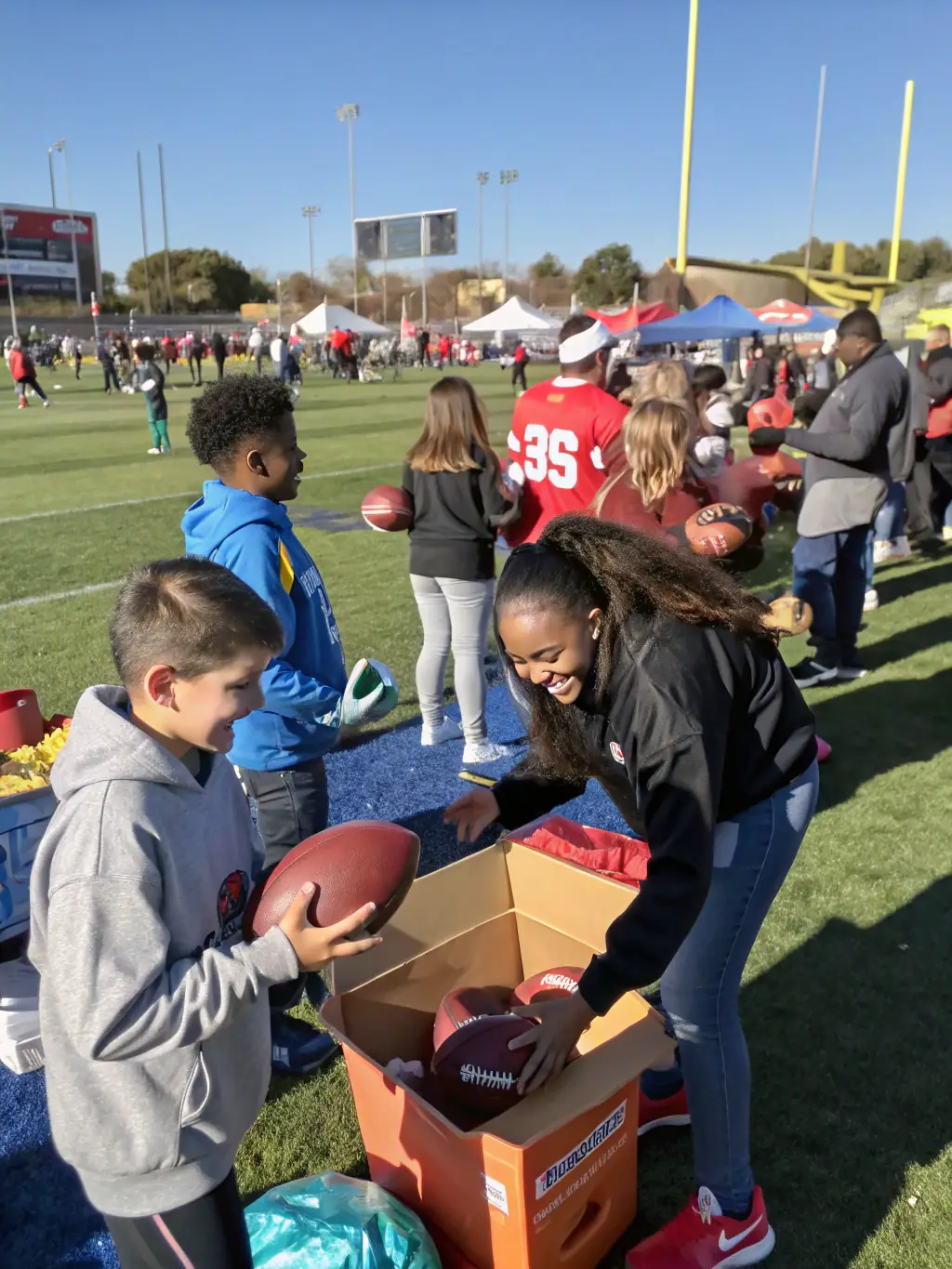 A photo of volunteers assisting at a local sports event, emphasizing the organization's commitment to community support and involvement.